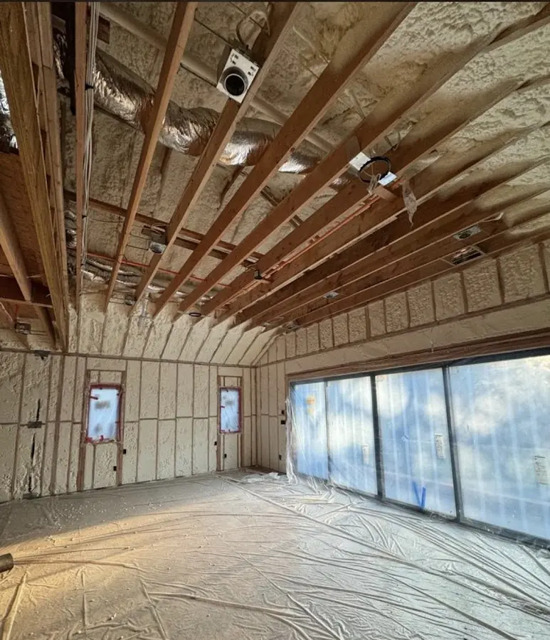 Interior walls and ceiling insulated with spray foam during new construction in West Park